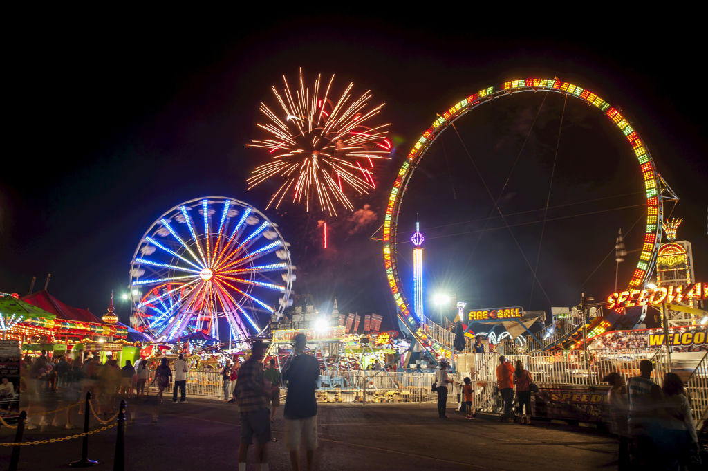 Fireworks and Ferris Wheels at Night at The Maryland State Fair. Timonium, Maryland, United States of America