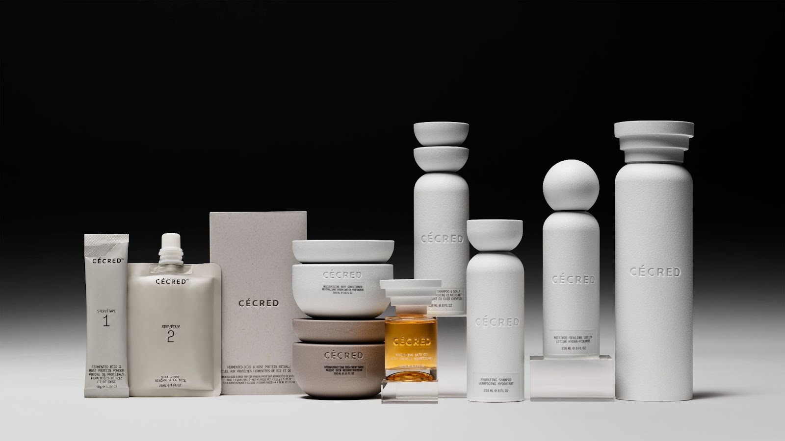 A collection of white ceramic containers and bottles with the Cecred brand name prominently displayed.
