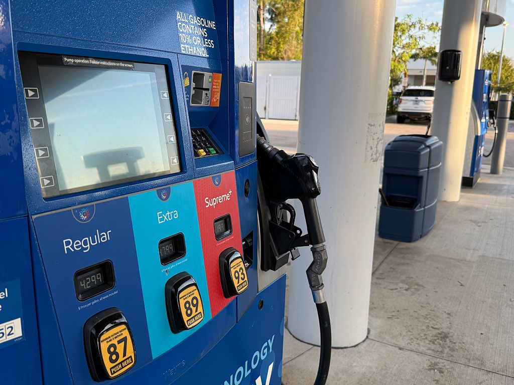 Gas pumps close-up showing fuel prices and credit card display, Synergy fuel technology, Mobil gas