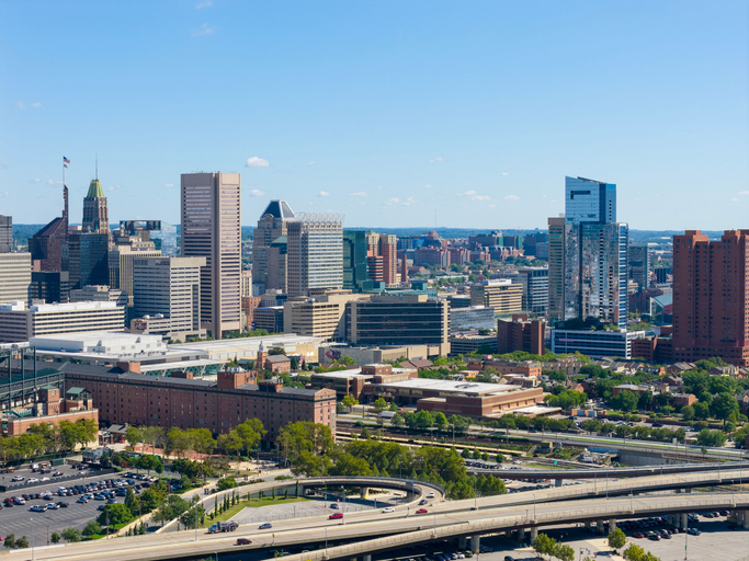 Baltimore city skyline with skyscrapers and highways.