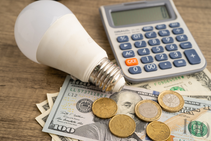 Cost of electric utilities with light bulb for payment.