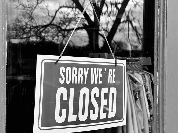 A shop window sign advising the shop is closed at Morpeth in Northumberland