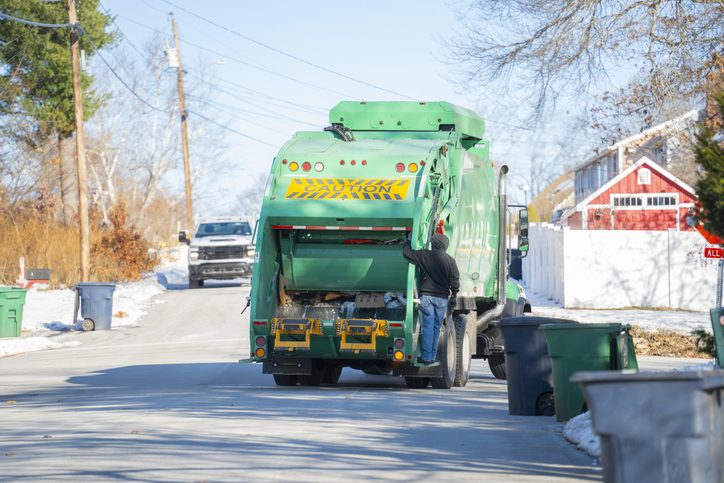 waste collecting truck in the street of residential area