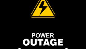 Power Outage Warning Sign on Black Background