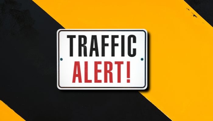 Traffic alert sign on orange and black background