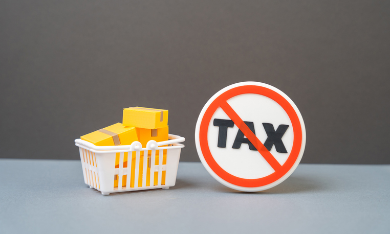Basket with parcels and tax free sign. Concept of duty-free shopping, delivery, logistics and international trade. No taxes and taxation