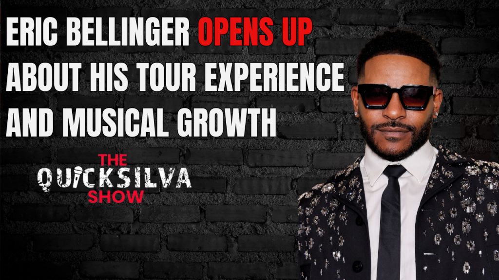 Eric Bellinger, a man wearing sunglasses and a suit, stands in front of a brick wall with the text "ERIC BELLINGER OPENS UP ABOUT HIS TOUR EXPERIENCE AND MUSICAL GROWTH THE QUICKSILVA SHOW".