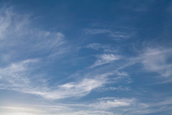 White Wispy Clouds in Blue Sky