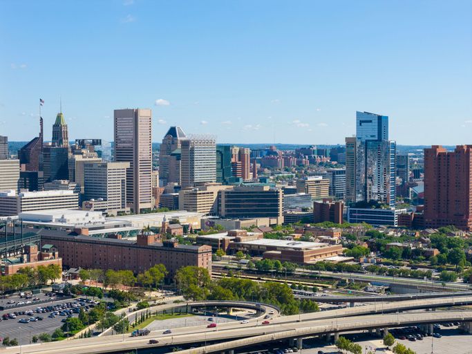 Baltimore city skyline with skyscrapers and highways.