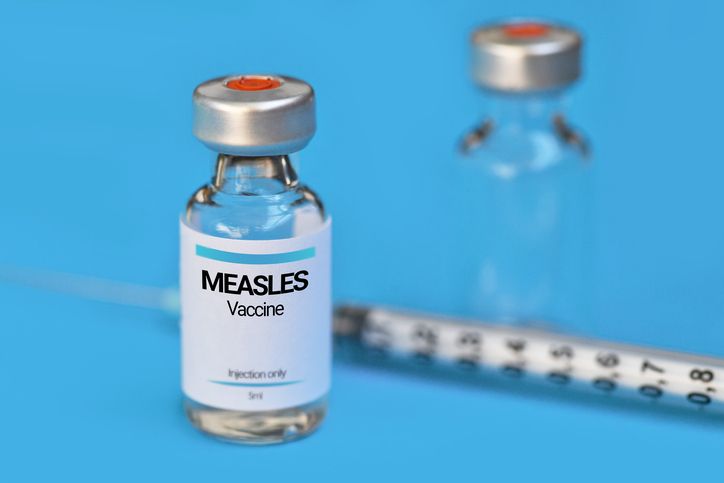 Small measles vaccine vial with syringe